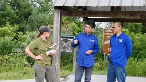 Photo of Christina Winfree and faculty conducting drone research